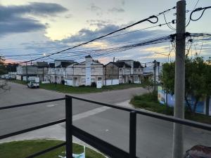 a view from a balcony of a street with houses at DS confort in General Pico