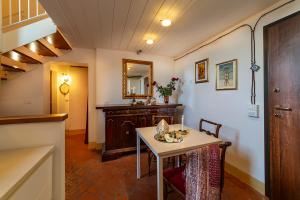 a dining room with a table and a mirror at House of Lovers - Magnificent View in the Heart of Bologna in Bologna +18 photos