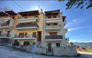 a building with balconies on the side of it at Panoramic cityview in Karpenision