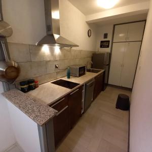 Kuchyňa alebo kuchynka v ubytovaní Apartman Nadia Seaview