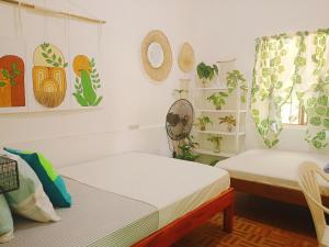 Postel nebo postele na pokoji v ubytování Amwani Garden