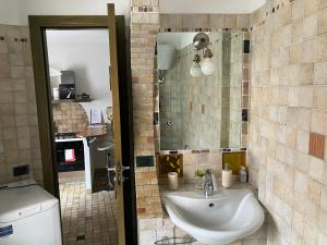 a bathroom with a sink and a toilet at Al Centro - Casa Vacanze in Potenza +29 photos