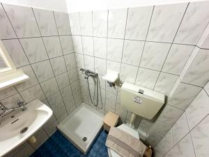 a bathroom with a toilet and a sink at Studios Melida in Skala Potamias