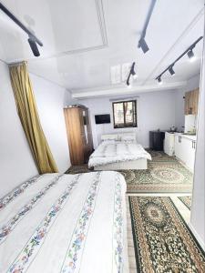 Ένα ή περισσότερα κρεβάτια σε δωμάτιο στο Apartment for 5 persons, in Chilanzar