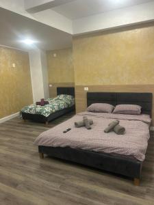 Ένα ή περισσότερα κρεβάτια σε δωμάτιο στο Apartament Negris New