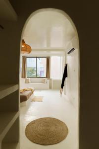 a living room with a couch and a rug at The Hidden Home in Patong Beach