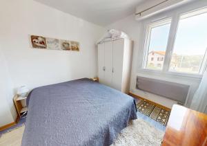 Ένα ή περισσότερα κρεβάτια σε δωμάτιο στο Bateau - T2 proche de l'océan à Hossegor