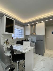 Η κουζίνα ή μικρή κουζίνα στο Escape Central Apartments