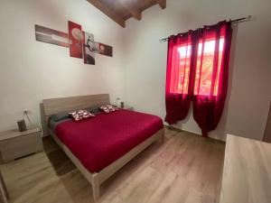 Ένα ή περισσότερα κρεβάτια σε δωμάτιο στο Casa vacanze Shardana