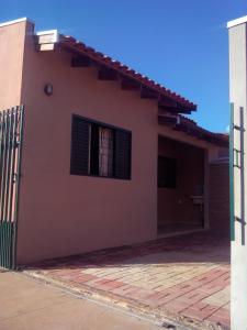 a house with a fence in front of it at CASA BONITA in Bonito