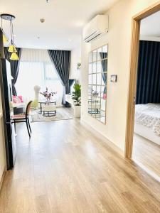 an open living room with a bed and a living room at Thỏ homestay in Gia Lâm Pho