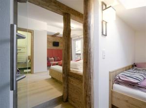 Łóżko lub łóżka w pokoju w obiekcie Ferienhaus Alpina