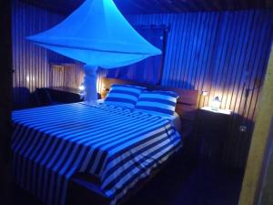 Letto o letti in una camera di Kribi-Lodge