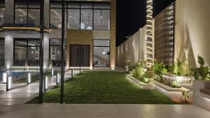 a building with a lawn in the middle of it at Luxurious villa in Riyadh