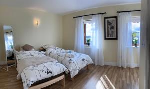 Postel nebo postele na pokoji v ubytování Lake View Doubleroom en Suite + 37 fotografií