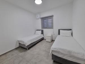 Albi Boutique Apartments客房内的一张或多张床位