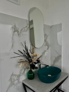 a bathroom with a blue sink and a mirror at Donna Maria Suite & Relax in Serino +72 photos
