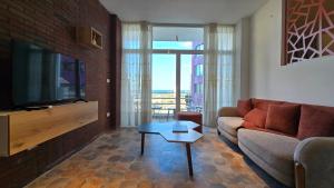 TV a/nebo společenská místnost v ubytování Hostland