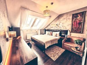 Posteľ alebo postele v izbe v ubytovaní Alfons Boutique Hotel