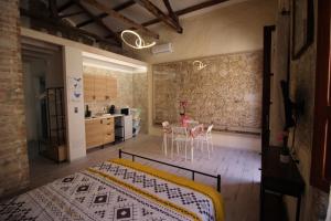 a kitchen with a table and chairs in a room at Luisa's in Cagliari