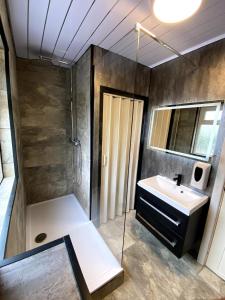 a bathroom with a sink and a shower at Cardiff Central Home Sleeps 11 in Cardiff