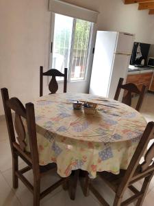 a kitchen with a table with a table cloth on it at Alojamiento en catamarca in San Isidro +1 photo