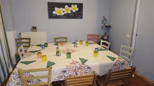 a dining room table with a white table cloth at Foresteria dell'Oasi in Morozzo