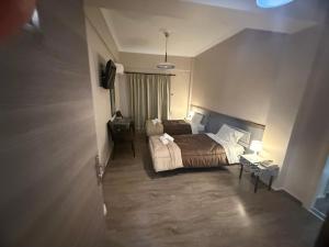 Postel nebo postele na pokoji v ubytování Hotel Koutriaris