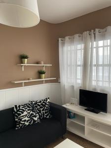 TV a/nebo společenská místnost v ubytování La Garita Bay Apartments + 11 fotografií
