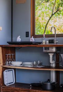 a kitchen counter with a sink and a window at Finca Murillo in Monteverde Costa Rica