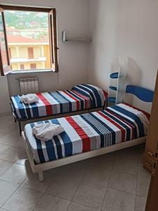 Letto o letti in una camera di Vincenzo Sea House