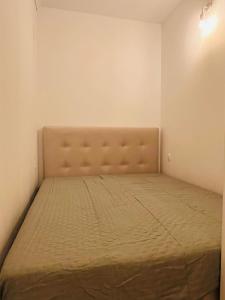 a bed in a small room with a mattress at Apollo Peraia Apartment in Perea