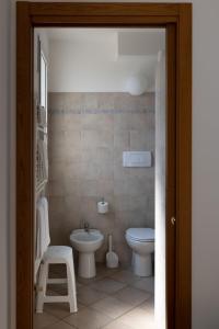 a bathroom with a toilet and a sink at Hotel La Gioiosa in Finale Ligure