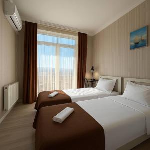 Postel nebo postele na pokoji v ubytování Hotel Marioni