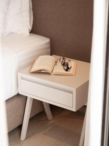 A bed or beds in a room at Ariadne Suites