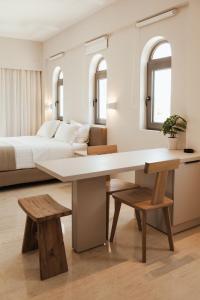 A bed or beds in a room at Ariadne Suites