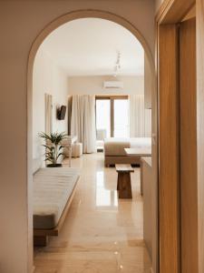 A bed or beds in a room at Ariadne Suites