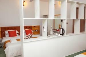 Uma cama ou camas num quarto em Velana Vibes at Mathiveri
