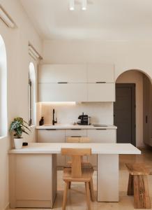 A kitchen or kitchenette at Ariadne Suites