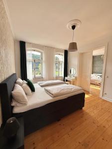 a bedroom with a large bed in a room at Villa Rheinblick 1 OG in Kamp-Bornhofen