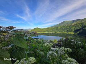 a view of a lake with mountains in the background at Seroja Hills Glamping Wonosobo in Kejajar