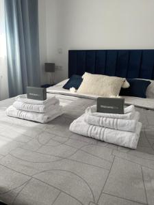 Postel nebo postele na pokoji v ubytování VG CITY STAY - airport & city