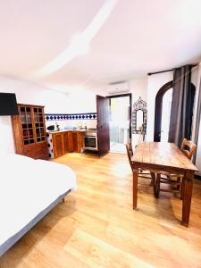 A bed or beds in a room at El Beaterio Apartments