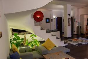 a living room with a couch and a staircase at American Villa Dahab in Dahab