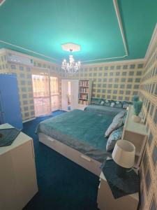 Ένα ή περισσότερα κρεβάτια σε δωμάτιο στο EWA Apartman