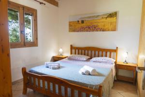 a bedroom with a bed with towels on it at Agriturismo Scalelle in Otranto