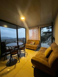 a living room with a couch and a table at Bella vista Ceci B1 in San Ramón +8 photos