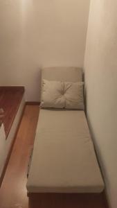 a small bed in a corner of a room at La casa del Amo , Trasmoz Y Moncayo in Trasmoz +10 photos
