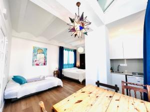 A bed or beds in a room at El Beaterio Apartments