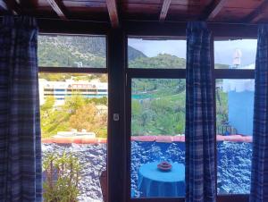 a window with a view of a mountain view at hotel dar lalla khadouj in Chefchaouen